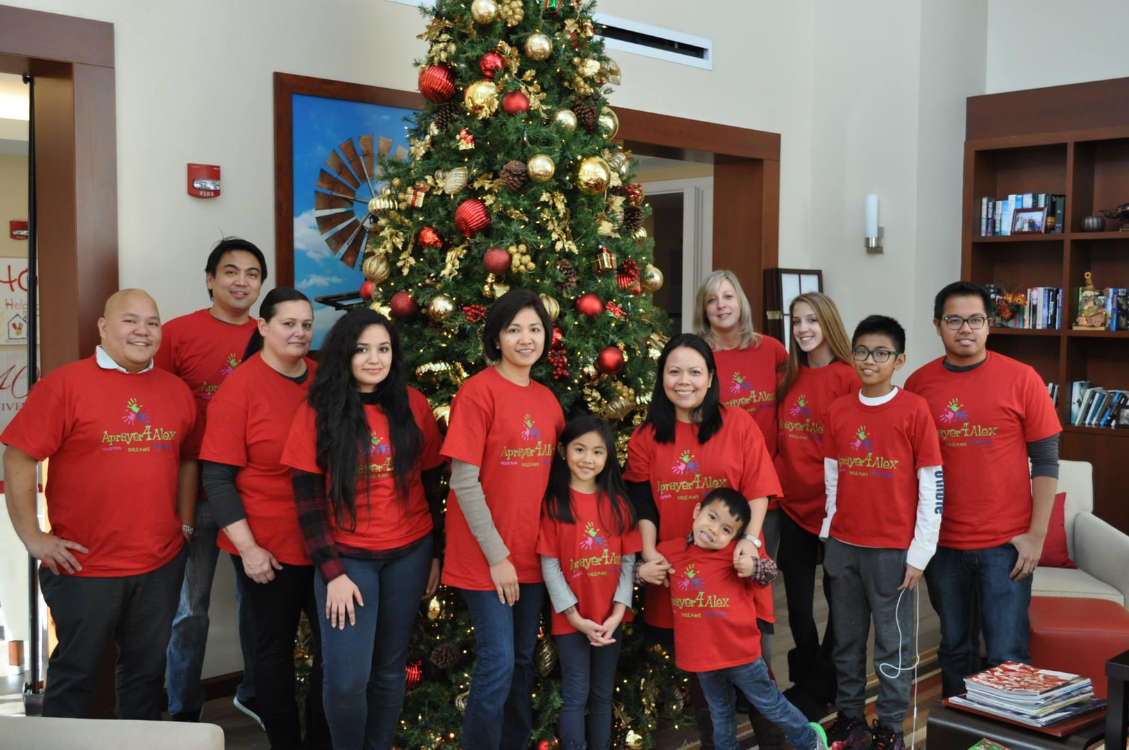 Aprayer4Alex team in red shirts at Christmas event